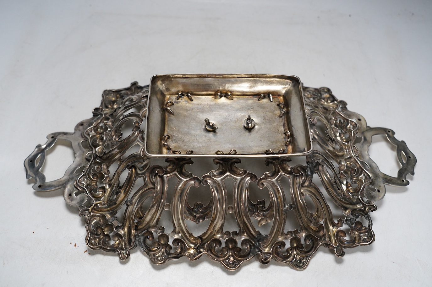 A late 19th/early 20th century Austro-Hungarian pierced 800 white metal fruit bowl, with unusual raised acorn base, 38.4cm, 12.2oz. Condition - poor (repair)